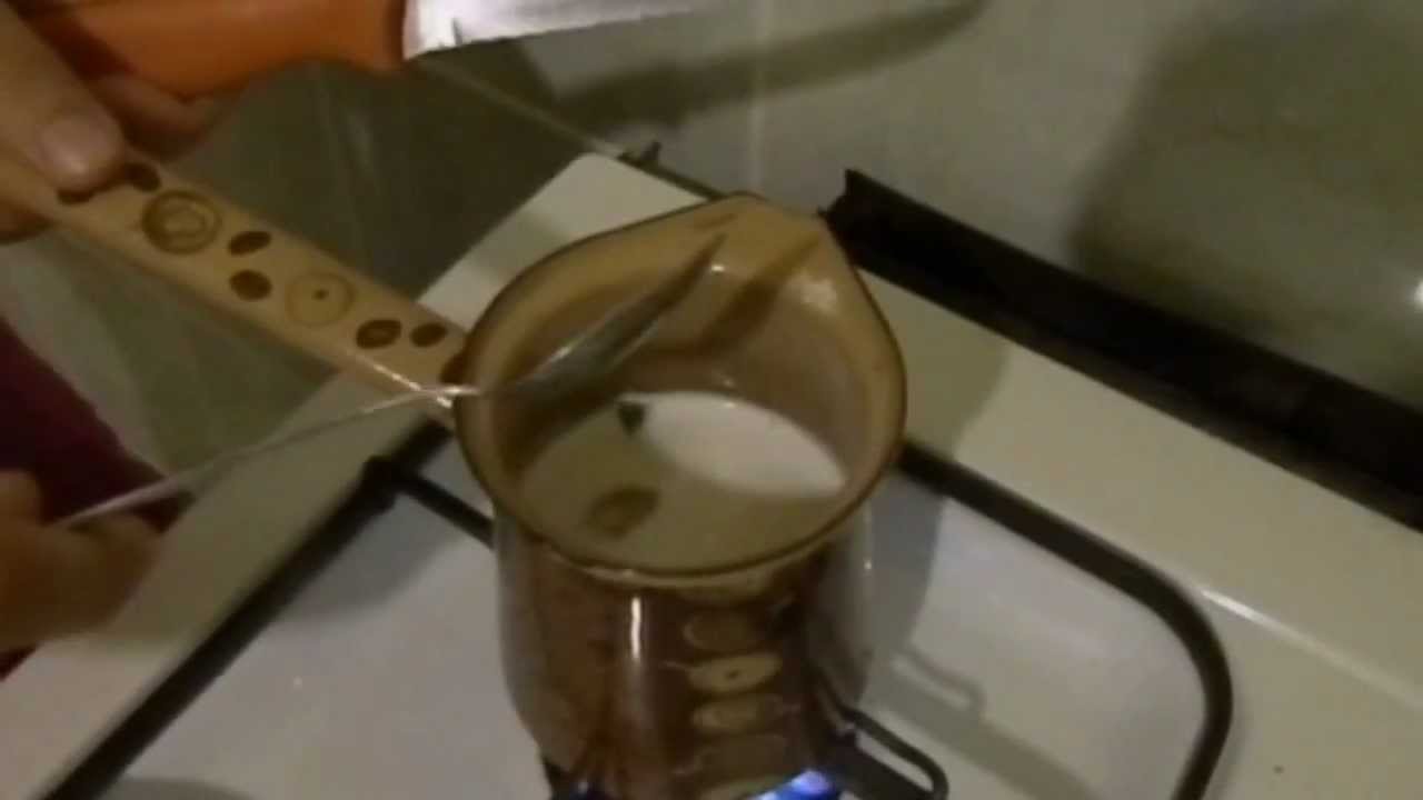 This is the picture of a kettle with milk inside.